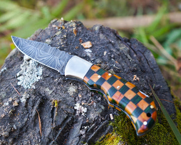 handmade folding damascus knife with impressive handle design
